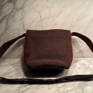 The sack brown shoulder bag with brown suede handle and side panel accents